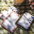 Load image into Gallery viewer, Set van notitieblokken met bloemendessins op een houten tafel, sfeervol vastgelegd in daglicht, ideaal voor schrijfliefhebbers.
